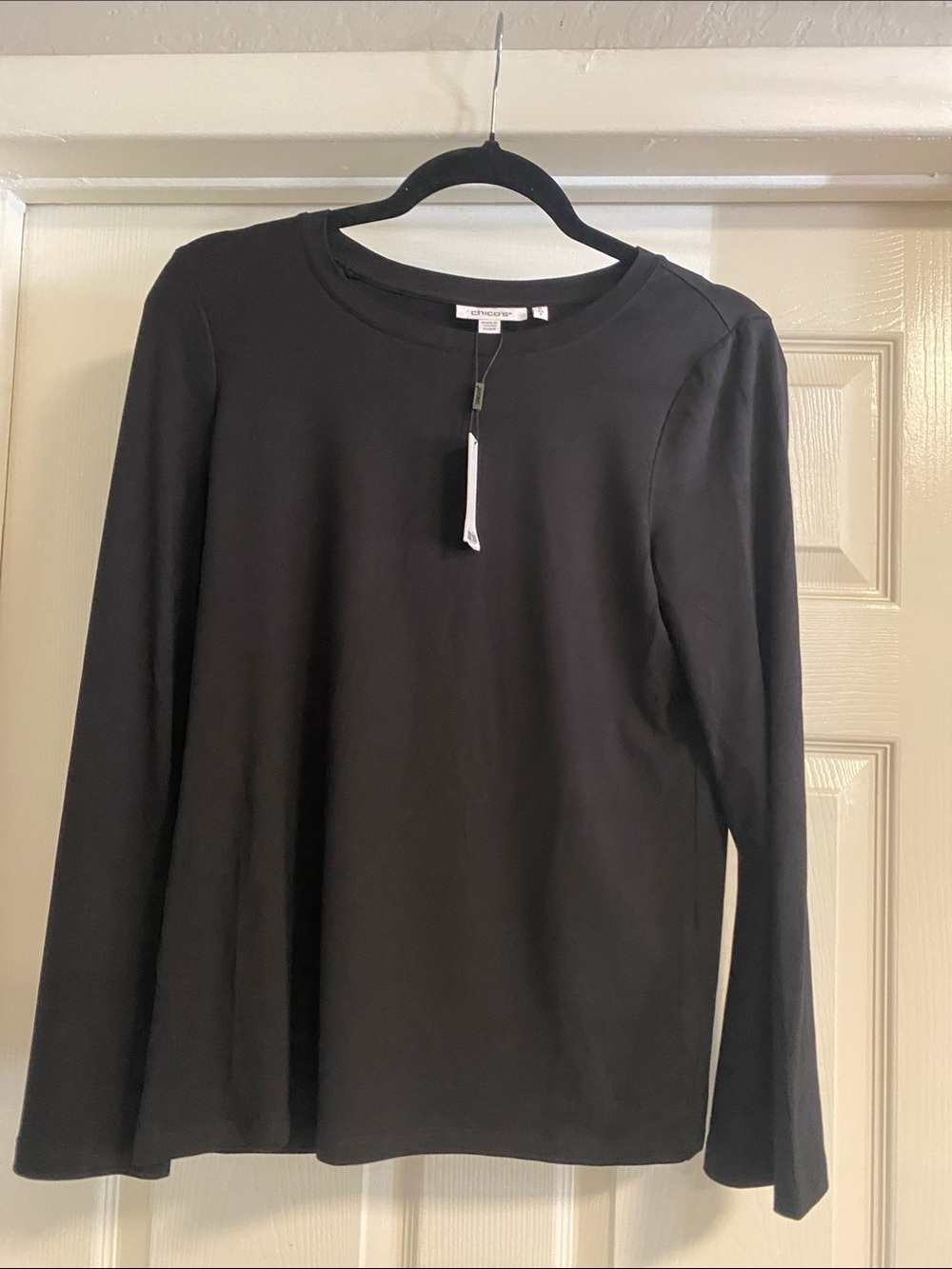 Chico’s woman’s Black top with bell sleeves size 0 BNWT